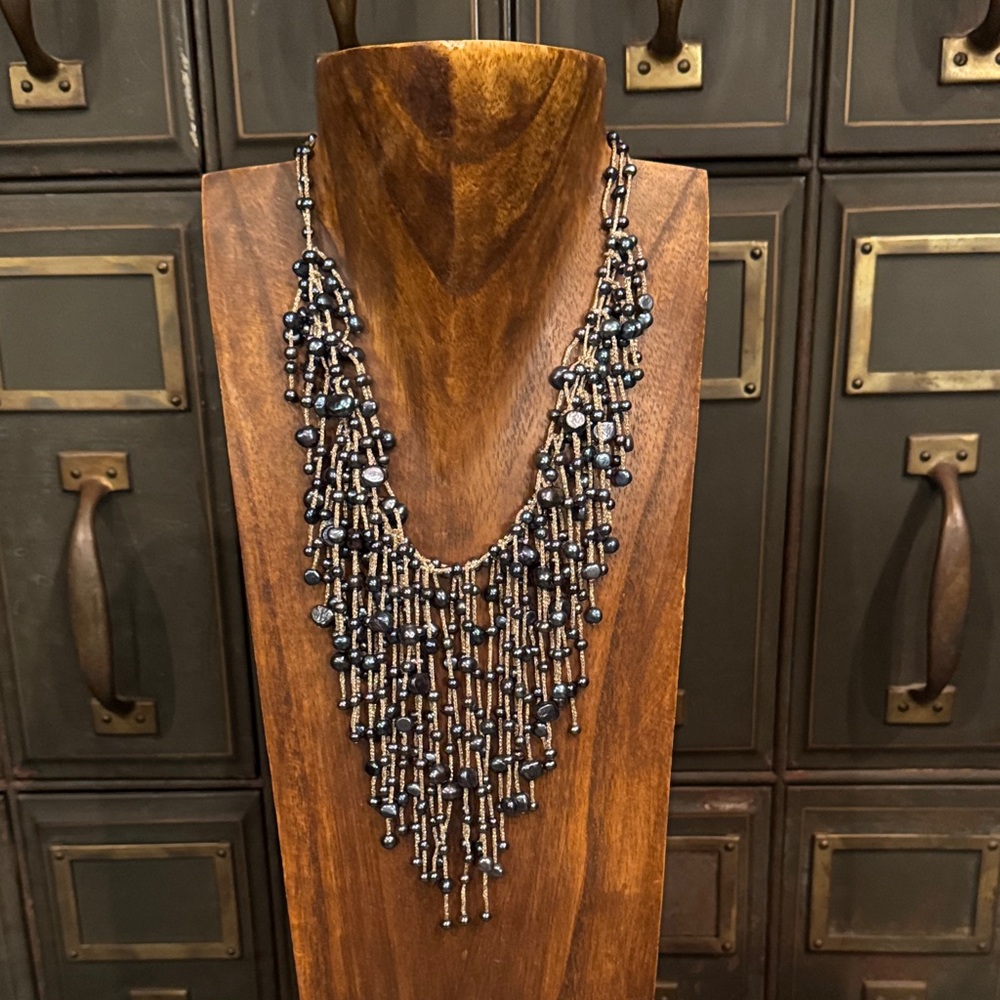 Waterfall necklace. Silver chain with steel blue beads. Length 17-19”.